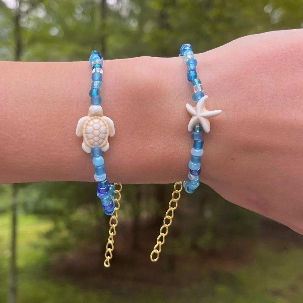 Handmade pack of matching blue beaded bracelets beach theme gold turtle starfish
